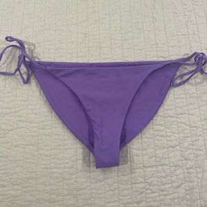 Purple string bikini bottom. Size medium. Purple. No damages.